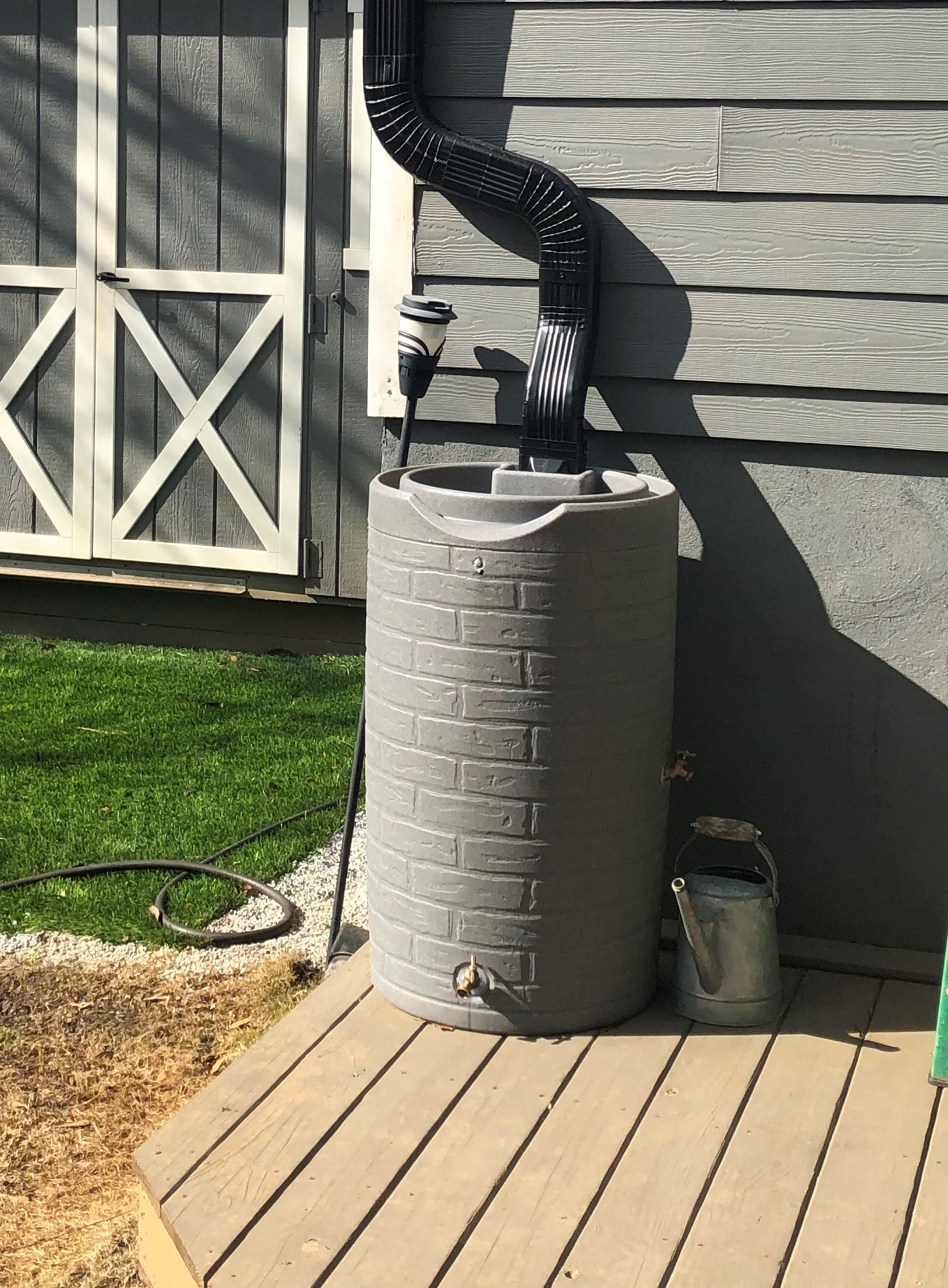 Rainwater collection system installed in a backyard